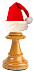 Schachfigur Läufer mit Nikolaus-Mütze